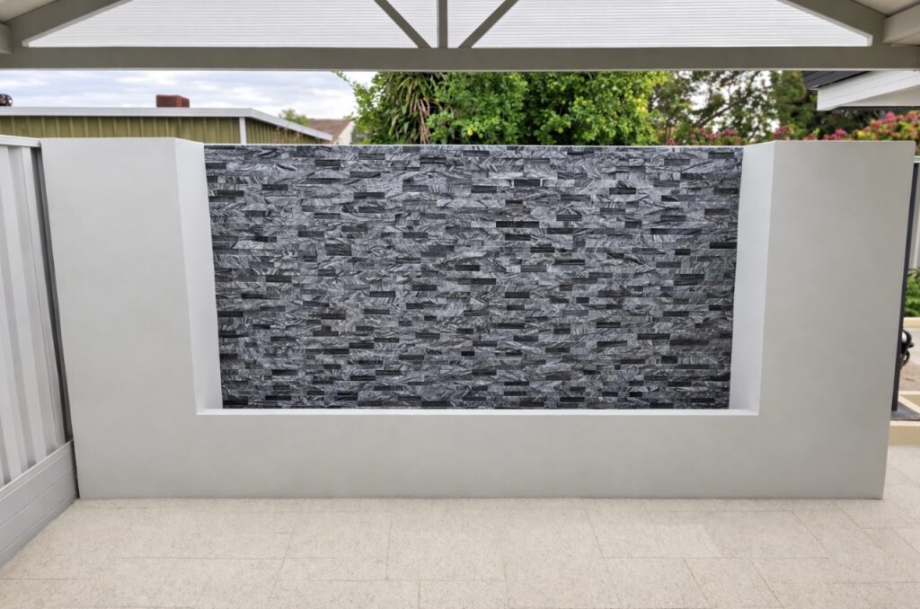 Decorative feature brick wall constructed for an outdoor entertaining area.