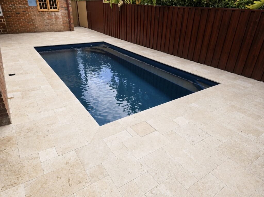 Travertine poolside paving installation in Cottesloe. 