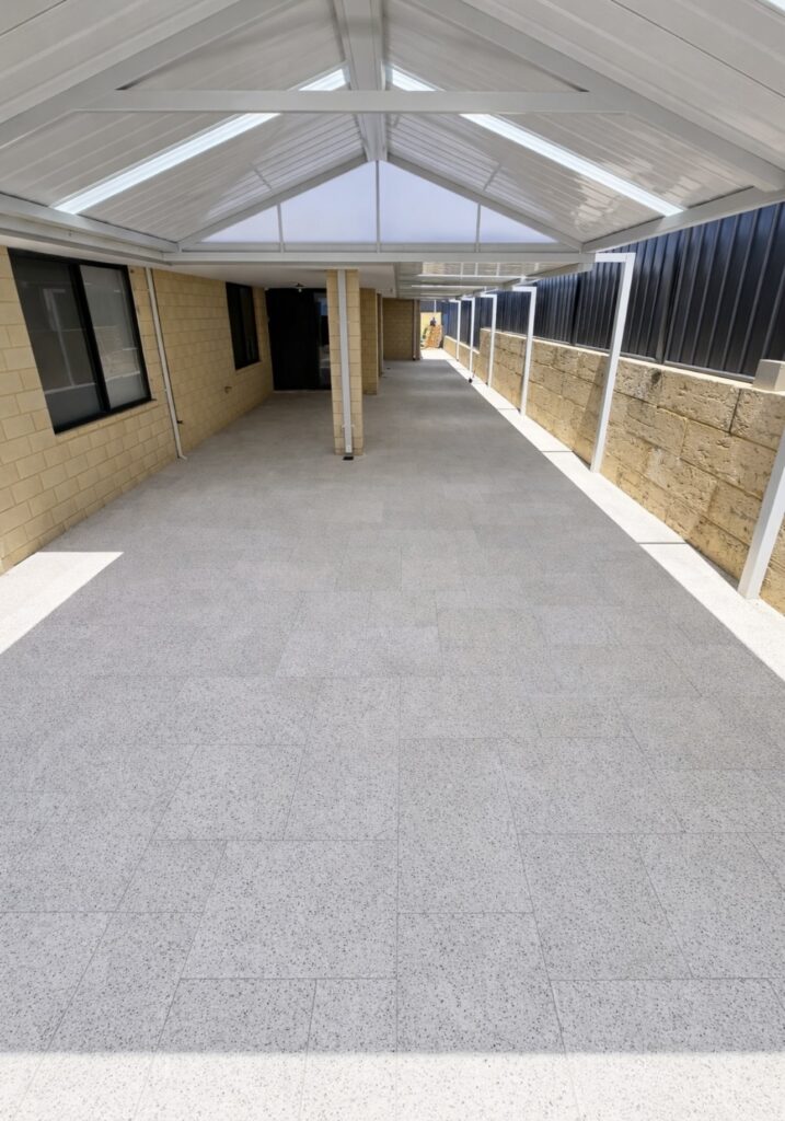 New paving installation to covered alfresco outdoor entertaining area and along the side of property. 