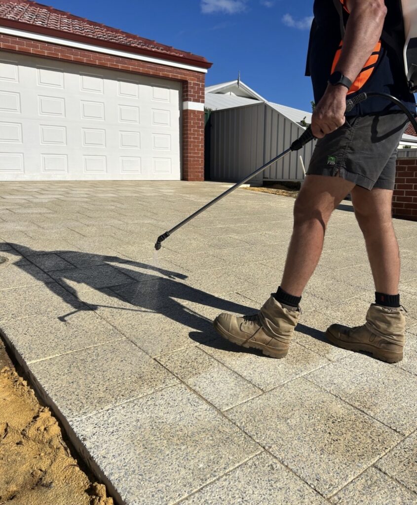 Driveway sealing applied to newly installed driveway paving. 